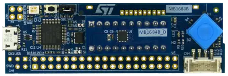 The image displays a blue electronic development board featuring various components, including a microcontroller chip, connectors, and buttons. The board is designed for programming and experimentation, with multiple pin headers for connectivity and an STMicroelectronics logo visible at the top.