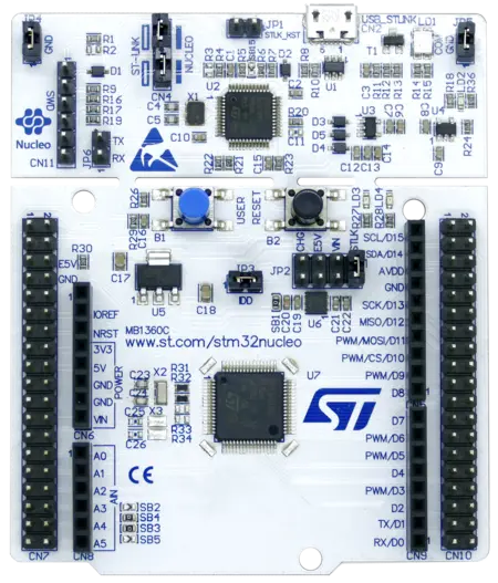 Image of a Nucleo development board featuring various connectors, buttons, and an integrated circuit chip. The board's layout includes labeled pins and components, designed for microcontroller prototyping, highlighting its application in electronics and programming projects.