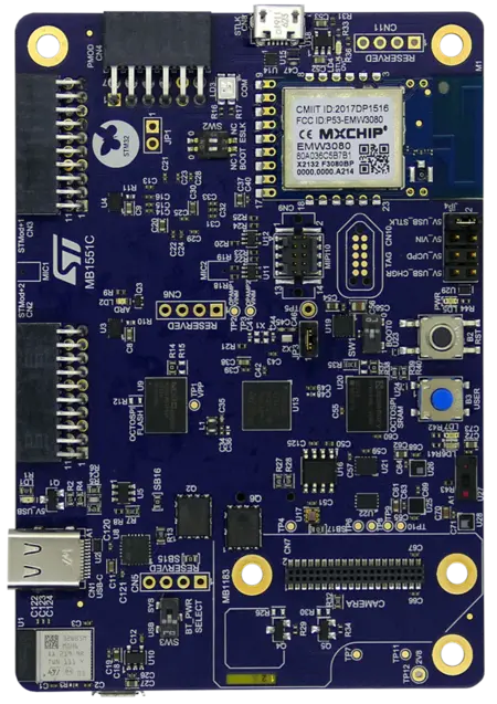 The image shows a blue printed circuit board (PCB) with multiple components, including microchips, resistors, and connectors. The board features labeled sections and ports, including a USB connection, and is designed for electronic applications. The manufacturer logo is visible at the top left.