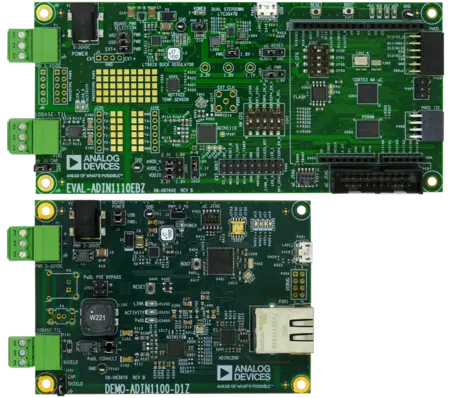 The image features two green printed circuit boards (PCBs) from Analog Devices. The top board, labeled "EVAL-ADIN1110EBZ," includes various components like capacitors and connectors. The lower board, "DEMO-ADIN1100-D1Z," displays additional electronic components and a USB port. Both boards are designed for electronic evaluations.
